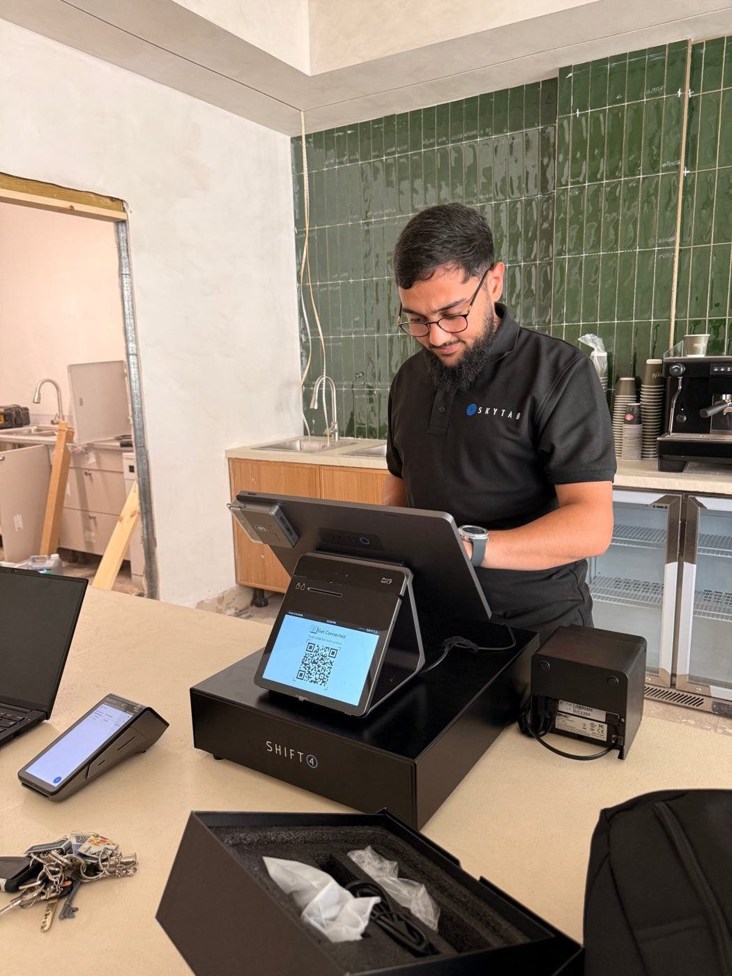 Configuring the till at Mochì Café during the fit-out