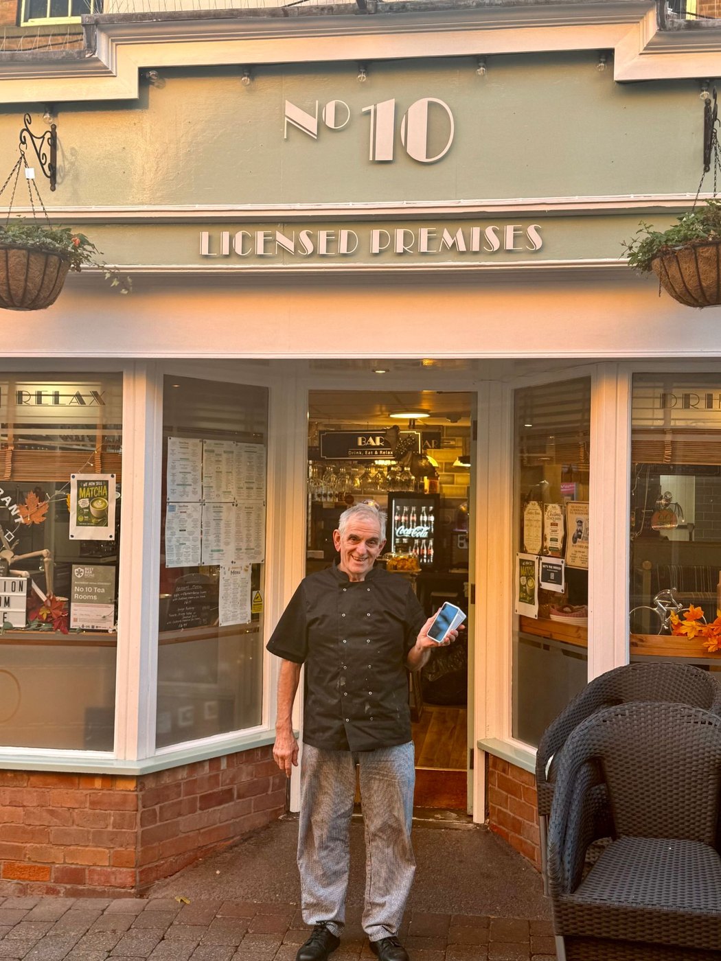 The owner of No. 10 Tea Rooms outside his restaurant
