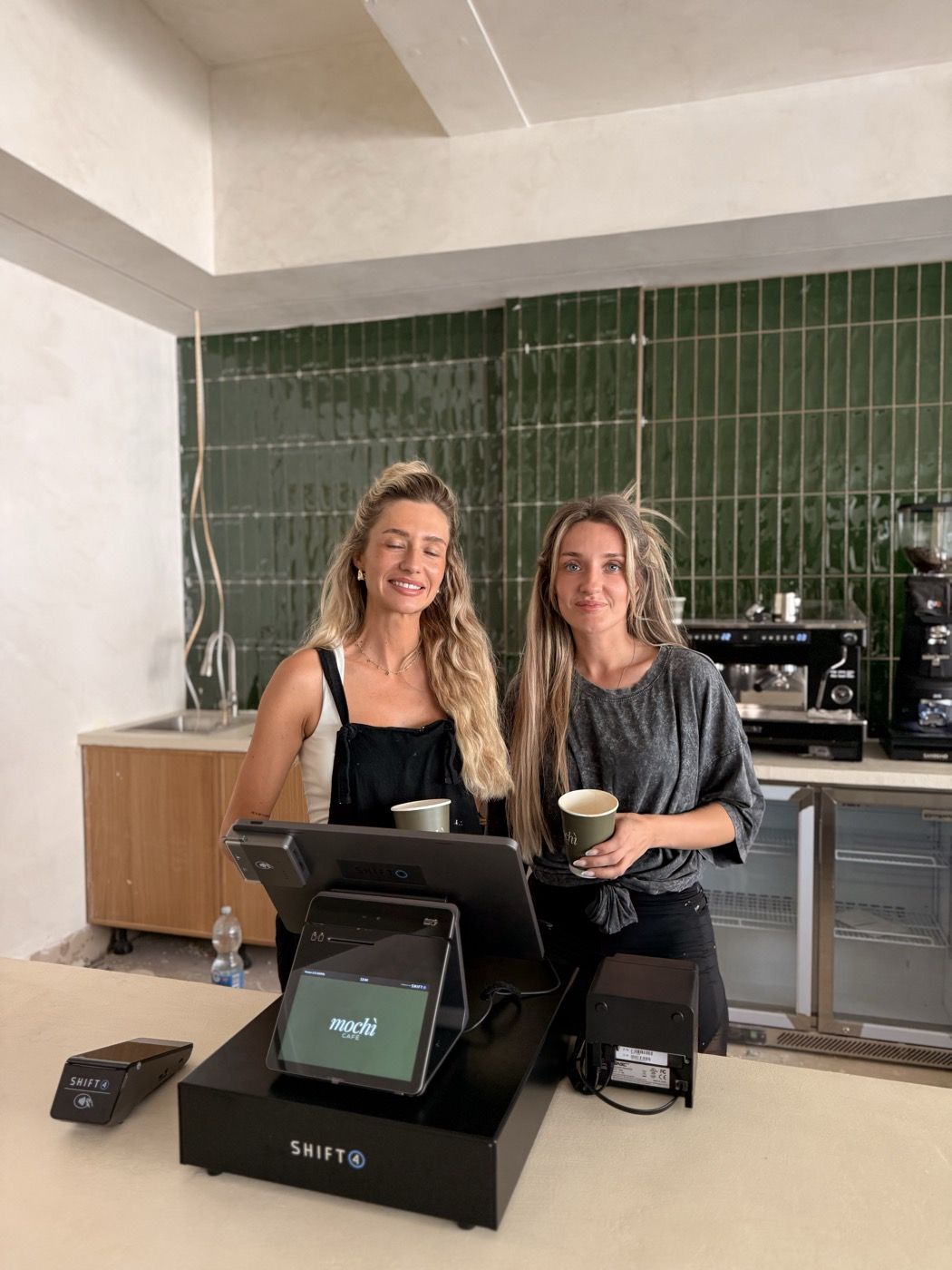 A counter till and card reader installed in a new cafe